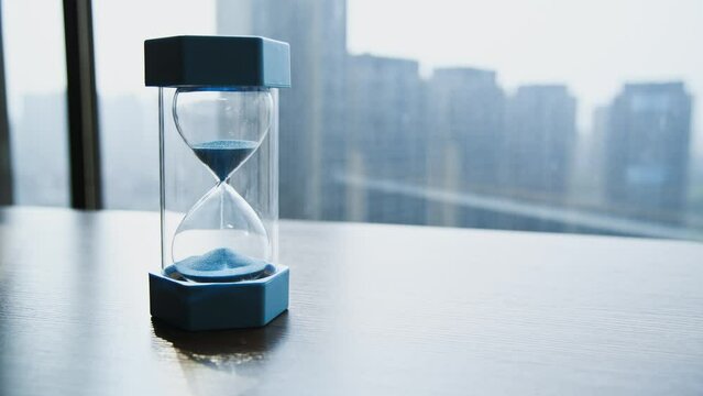 Single hourglass on the table of room