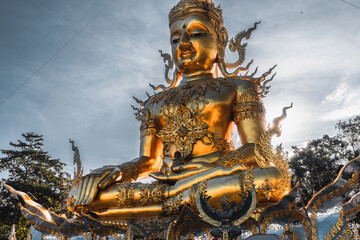 Thailand's most recognizable landmarks big golden Buddha statue in Thailand temple. Asian culture and religion