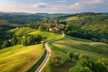 Fototapeta premium Winding road through lush green countryside scenic landscape panoramic view nature rural tranquility