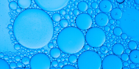 Abstract background of water drops blue bubbles of oil in liquid