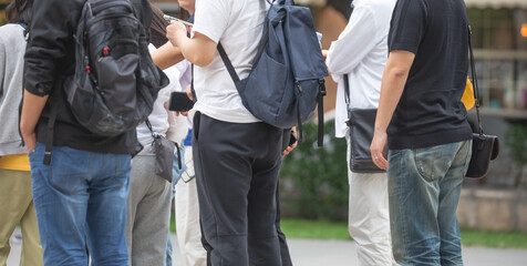 Tourists in a backpack in the city.