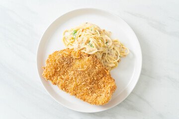 spaghetti pasta white cream sauce with fried fish