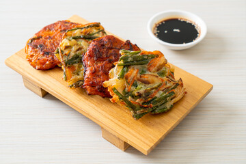 Pajeon or Korean pancake and Korean Kimchi pancake or Kimchijeon on white background