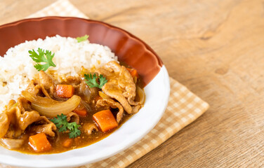 Japanese curry rice with sliced pork, carrot and onions