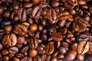 Brown Roasted Coffee Beans Closeup On, selective focus, soft focus.    