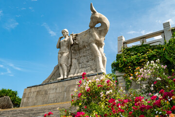 China Hainan island, Sanya city symbol, girl and the deer turning his head