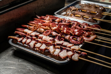 Grilled squid skewers sold in street food China