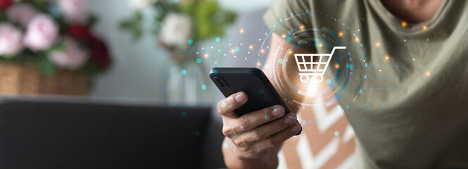 man using smartphone with application online shopping platform and shopping cart icon during sitting at home, Application online shopping marketing platform concept