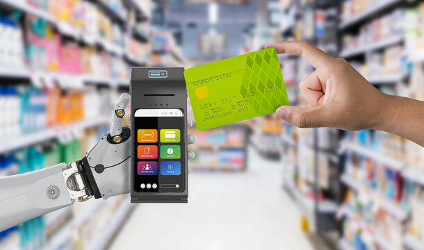 Cashless payment with robot hand holding credit card reader with credit card