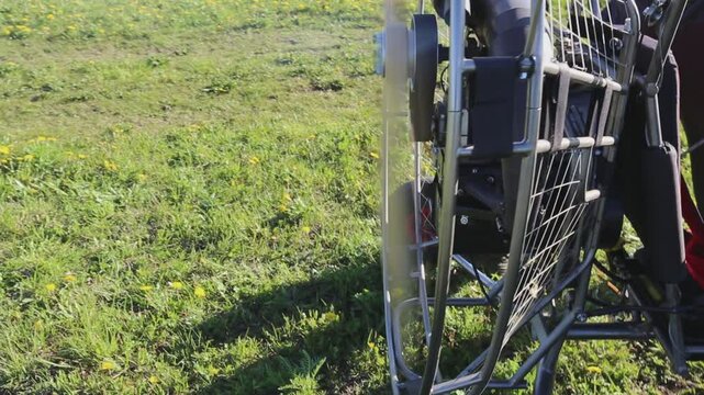 Starting paraglider motor for paragliding flights. Preparing paralet with a gasoline engine for flights. Extreme sports. Engine sound