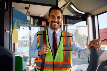 Happy driver inside of city bus looking at camera. © Drazen