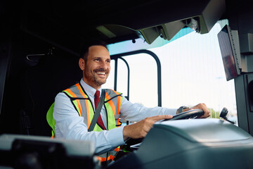 Happy school bus driver driving  bus.