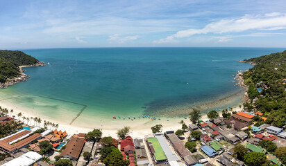 Naklejka premium Koh Phangan, Thailand: Aerial panoramic of the famous Haad Rin beach in Koh Phangan island in Thailand, famous for its full moon parties.
