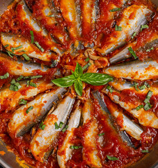 Sardines stewed in tomato sauce with spices. Lunch or dinner. Diet menu. Keto diet. Top view. Texture, background