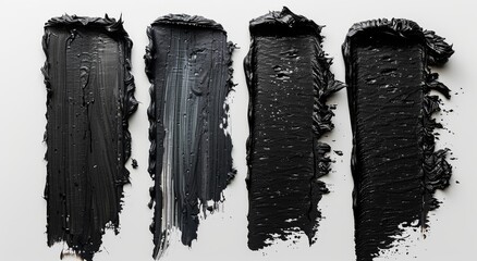 Four black paint strokes on white, versatile for design