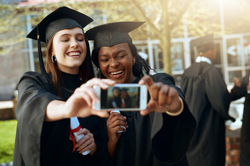 Fototapeta premium Happy girl, students and graduation with selfie for memory, photography or picture at university. Excited female person, friends or young graduates with smile for moment, degree or diploma on campus
