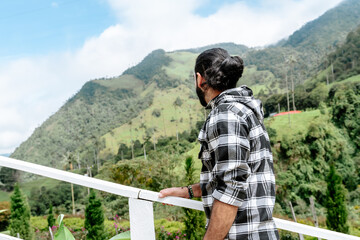 Latin man traveler, happy to know the Cocora Valley in Colombia. Photography, travel and excursion.