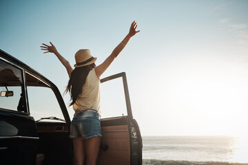 Woman, back and stretching with sunset by car for road trip, adventure or stop on outdoor journey. Female person enjoying break, summer vacation or travel for freedom, view or drive by ocean coast