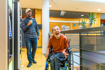 Man with cerebral palsy laughing next to coworker