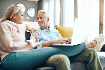 Smile, sofa and senior couple with laptop at home for online travel booking, information or decision. Woman, man and love with tech in living room for web registration, trip plan or digital itinerary