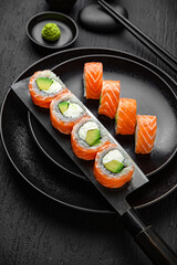 Philadelphia Classic Roll.Sushi composition on black background. The Art of Japanese Cuisine. Food photography for menu and sushi bar decoration