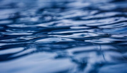 A image of blue ocean waves featuring a water surface in detail