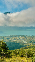 Scenic Overlook of Lake Batur with Cloud-Capped Peaks