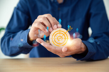 Hand holding target , business goals and focused concepts, Organizational growth and objectives,...