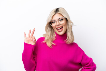 Young Russian woman isolated on white background showing ok sign with fingers