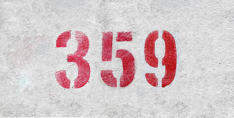 Red Number 359 on the white wall. Spray paint.