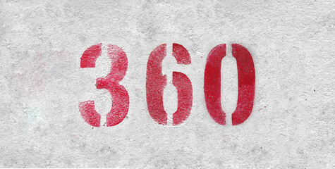 Red Number 360 on the white wall. Spray paint.