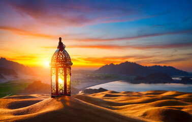 Fototapeta premium oriental lamp in sand at ramadan night, landscape with bright sunset background. Generative AI.