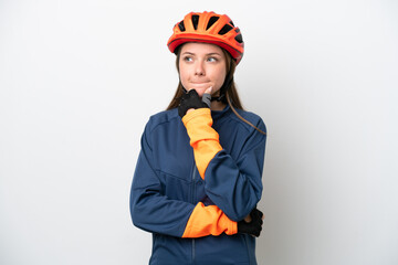 Young cyclist Lithuanian woman isolated on white background having doubts and thinking