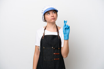 Fishmonger woman wearing an apron with fingers crossing and wishing the best