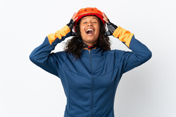 Teenager cyclist woman isolated on white background with surprise expression
