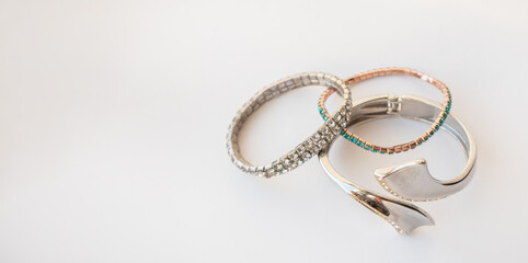 A set of women's metal stylish bracelets, fashion accessories, a copy of the space on the left