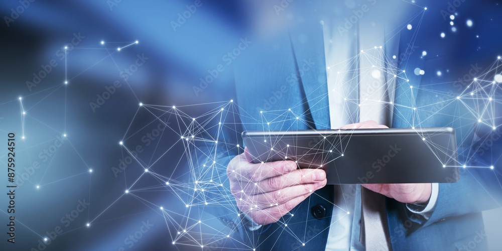 Poster A businessman using a tablet with network connection graphics overlay, digital concept on a blurred blue background