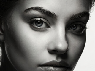 A monochrome, blurred portrait emphasizing light and texture.