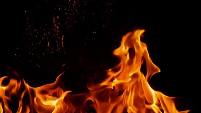 Slow motion shot of flames and fire on a black background.