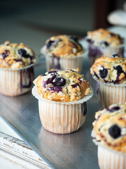 blueberry crumble muffins on baking tray