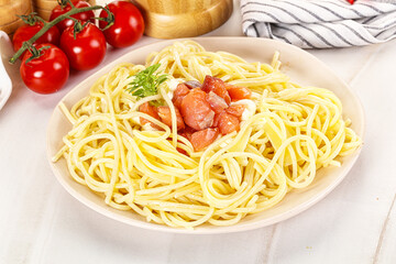 Pasta spaghetti with salmon and stracciatella
