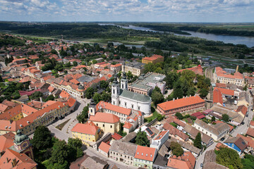 Aerial view of Sremski Karlovici town, orthodox cathedral and Danube river on sunny day. Serbia.