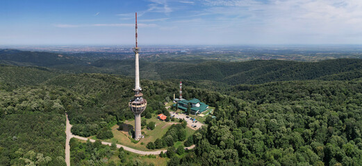 Panoramic aerial view of Irishki Venac Tower (partly destroyed by NATO bombing) in Frushka Gora national park on sunny day. Serbia.