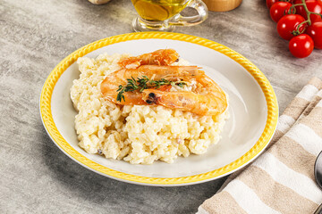 Italian risotto with prawn served thyme