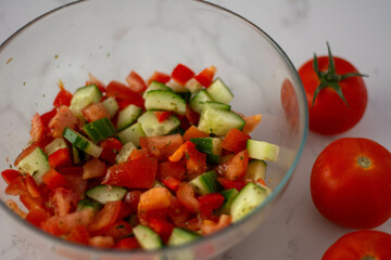 A fresh home-made salad with tomato and cucumbers 