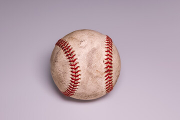 a used dirty old white baseball