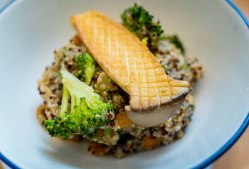 Healthy quinoa bowl with avocado, mushrooms and fresh vegetables