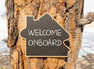 Welcome onboard symbol. Concept words Welcome onboard on beautiful black house blackboard....