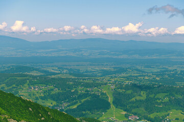 Beautiful mountain landscape overlooking the valley and the city. Tatra Mountains, Zakopane, Poland. Summer 2024.