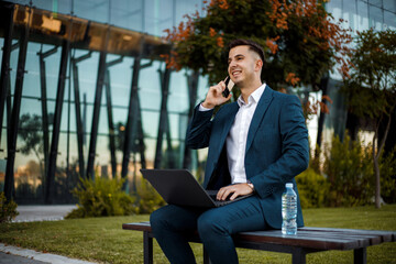 Man Sitting on Bench Talking on Cell Phone